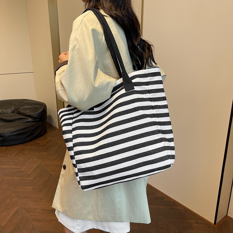 Women's Large Capacity Single Shoulder 2025 New Women's Designer Bag Niche Zebra Print Canvas Handheld Mother Handbag Outdoor Leisure Multif