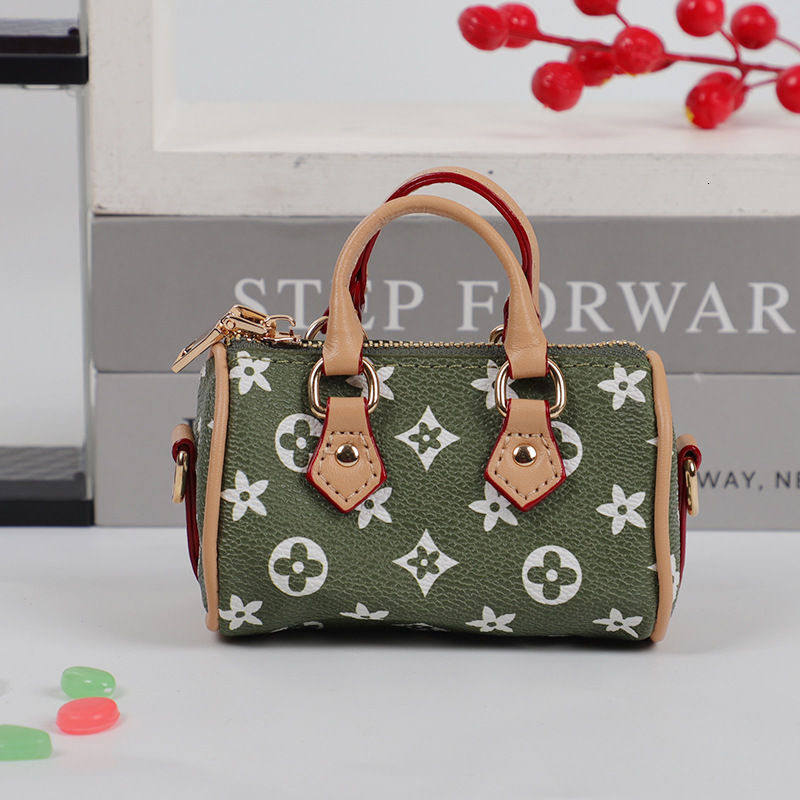 designer bag charm 2025 new mini small earphone cute creative casual pillow bag car keychain pendant for women