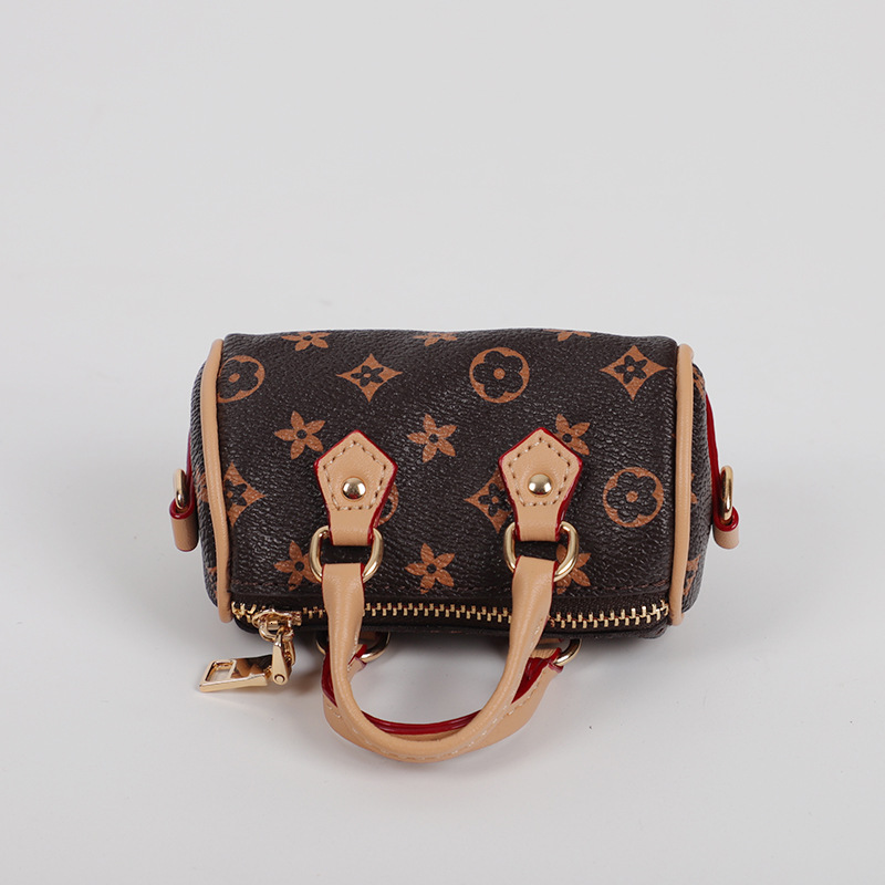 designer bag charm 2025 new mini small earphone cute creative casual pillow bag car keychain pendant for women