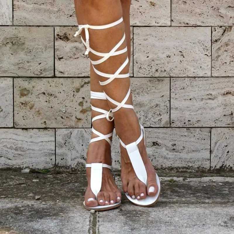 New Gladiator Womens Flat Shoes Womens Toe Clamp with Moon Sandals Womens Beach ShoesXJ250410