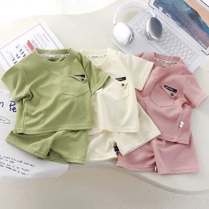 Childrens clothing summer waffle short sleeved set fashionable boys and girls casual sportswear thin solid childrens top+pants setXJ250410