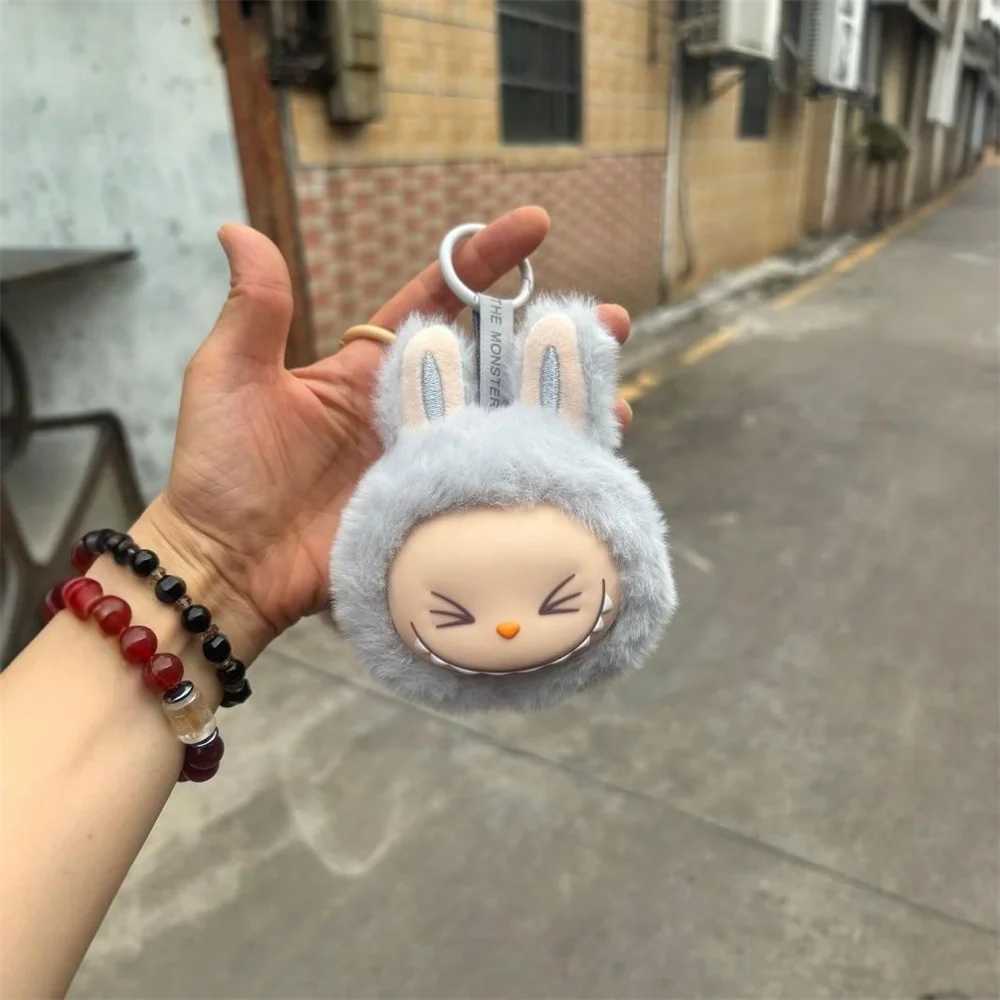 Sitting on the outside of Labubu doll keychain implanted with Fluff Pvc toy phone decoration bag charming car keychain Christmas gift W250411