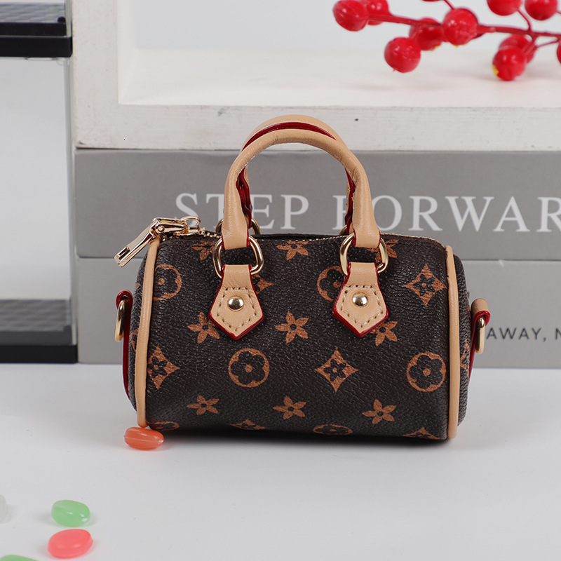 designer bag charm 2025 new mini small earphone cute creative casual pillow bag car keychain pendant for women