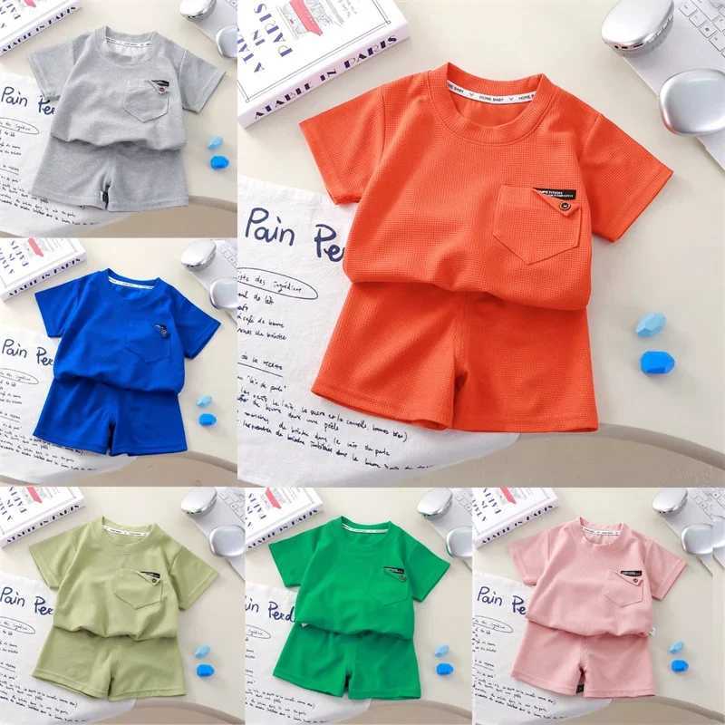 Childrens clothing summer waffle short sleeved set fashionable boys and girls casual sportswear thin solid childrens top+pants setXJ250410