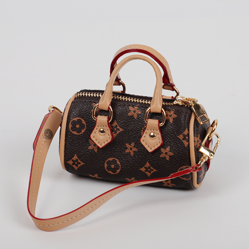 designer bag charm 2025 new mini small earphone cute creative casual pillow bag car keychain pendant for women