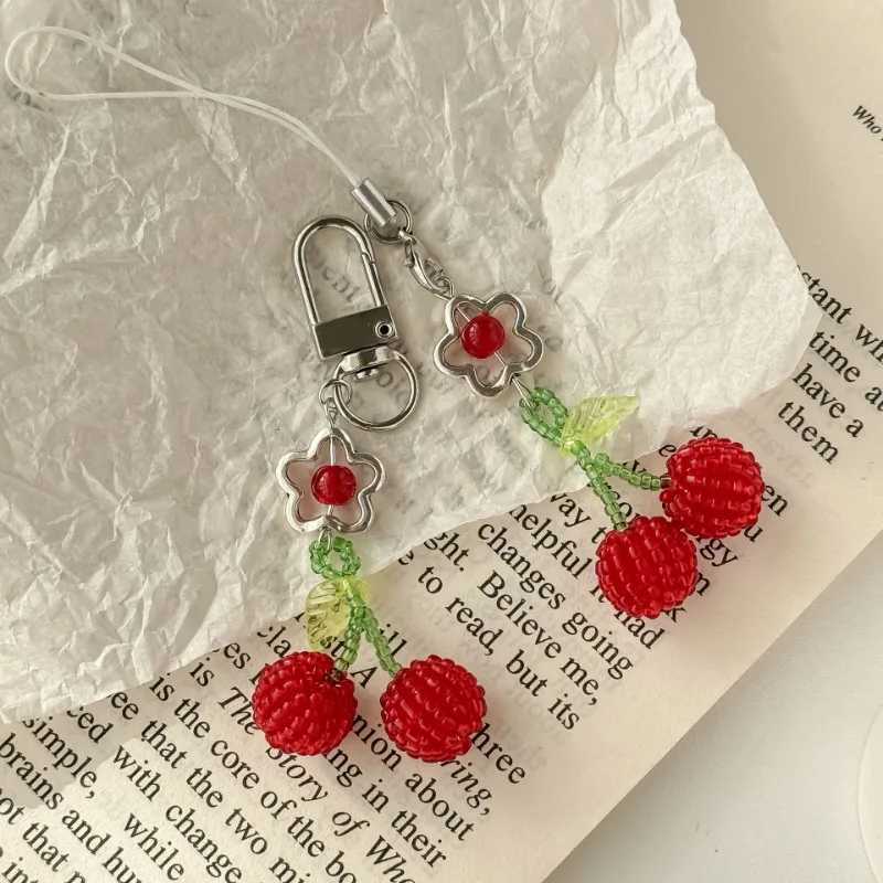 Simple and cute cherry phone pendant handmade bead decoration bag pendant keychain W250411