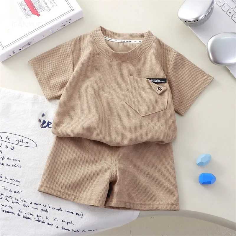 Childrens clothing summer waffle short sleeved set fashionable boys and girls casual sportswear thin solid childrens top+pants setXJ250410