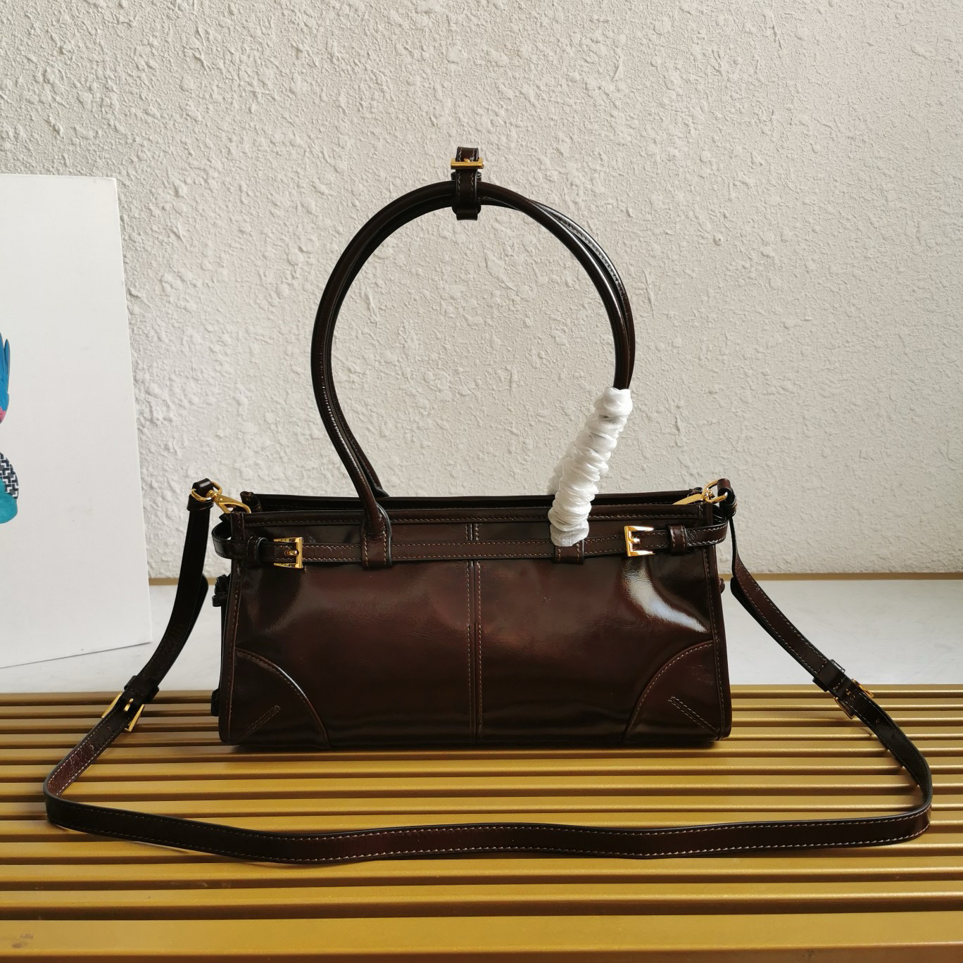 Bonnie medium leather handbag Enamel metal logo Nappa and nylon interior with central zippered compartment and zippered patch pockets Leather handle 1BA426