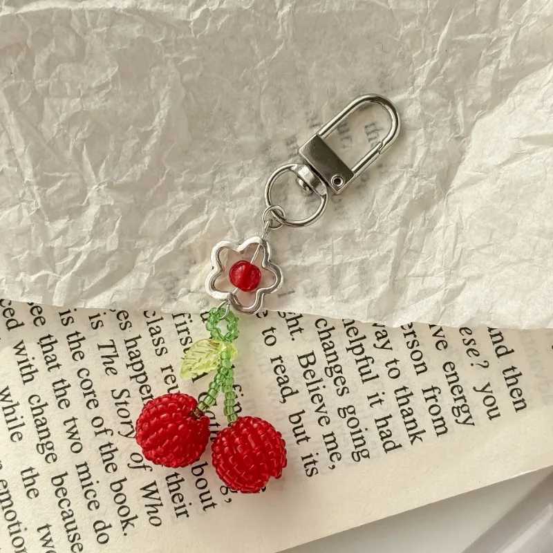 Simple and cute cherry phone pendant handmade bead decoration bag pendant keychain W250411