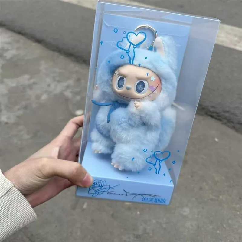 Zimomo Transforms Into A Baby With Blue Puffs And Pink Hearts Labubu Is A Plush Toy Made Of Vinyl With A Blue And Pink Leader W250411