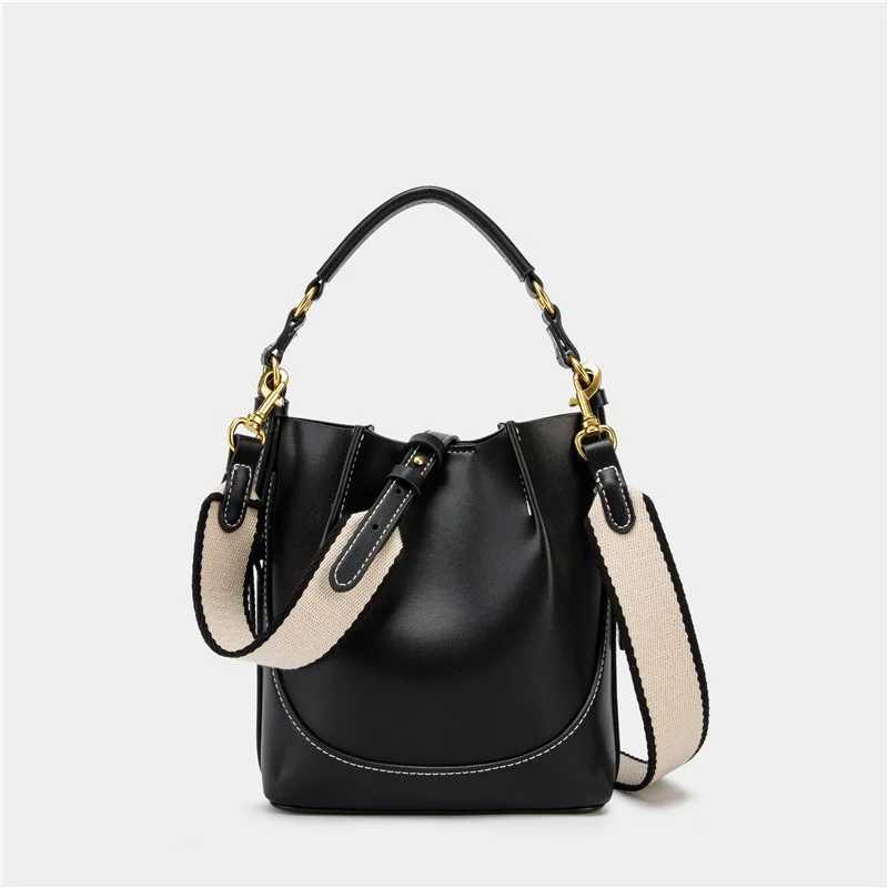 Spain 2025 new womens bag brown pleated drawstring versatile hand-held bucket bag wide shoulder strap diagonal cross bagT251110