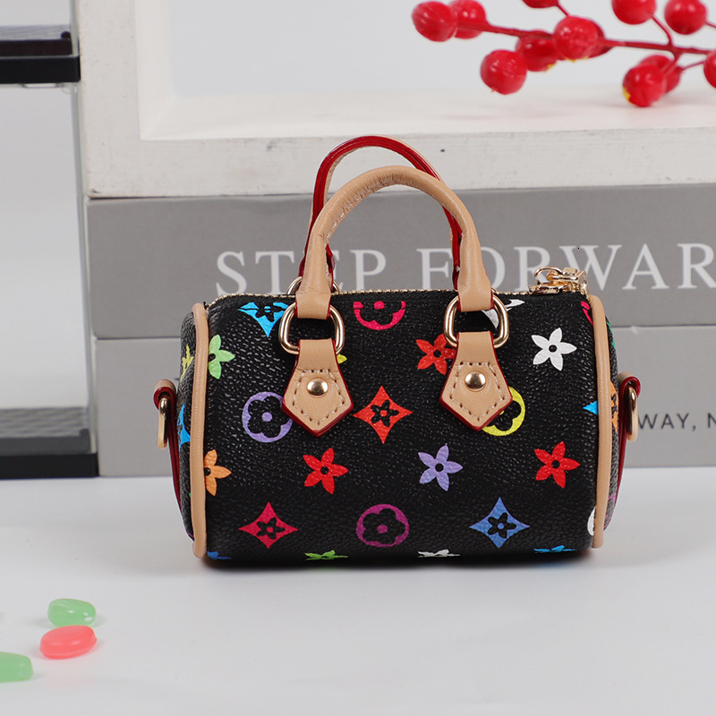 designer bag charm 2025 new mini small earphone cute creative casual pillow bag car keychain pendant for women