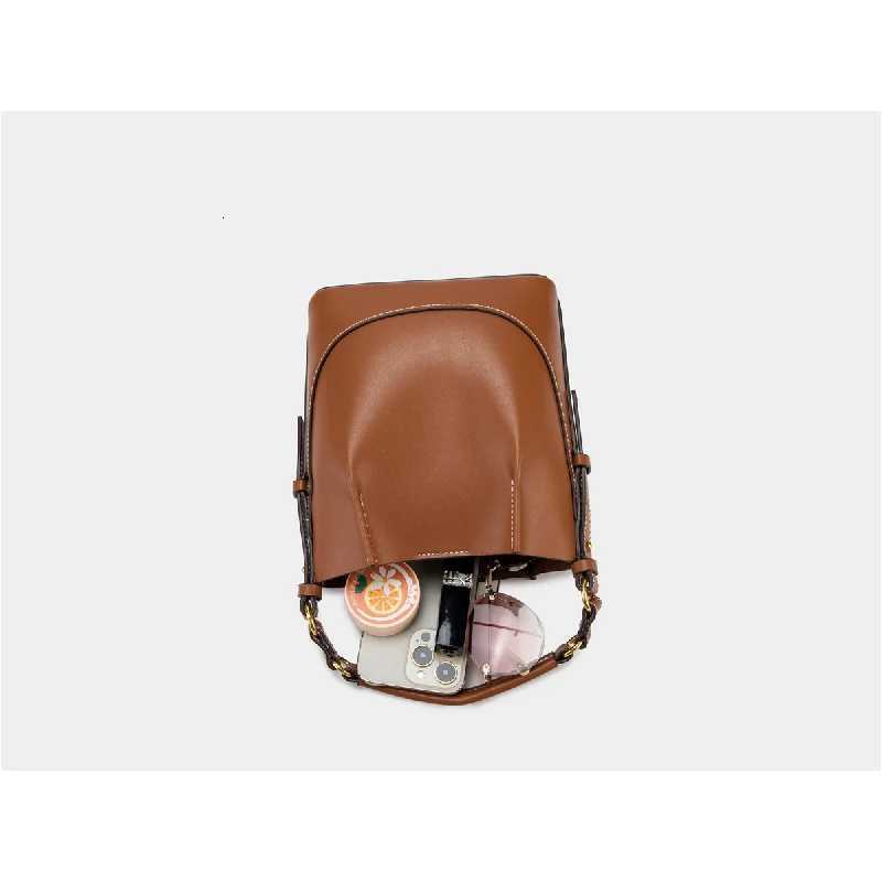 Spain 2025 new womens bag brown pleated drawstring versatile hand-held bucket bag wide shoulder strap diagonal cross bagT251110