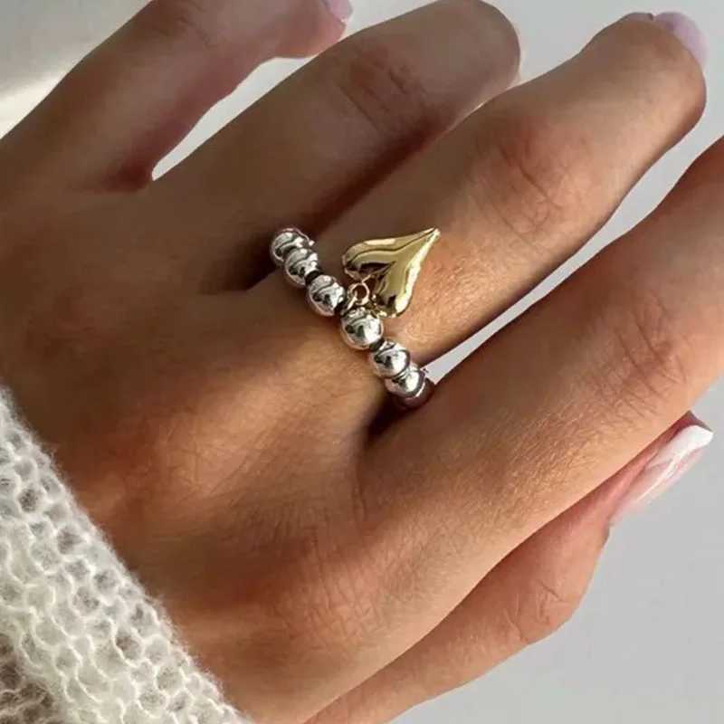 Creative metal heart elastic rope string CCB round bead ring gold heart pendant European and American adjustable ringXJ250412