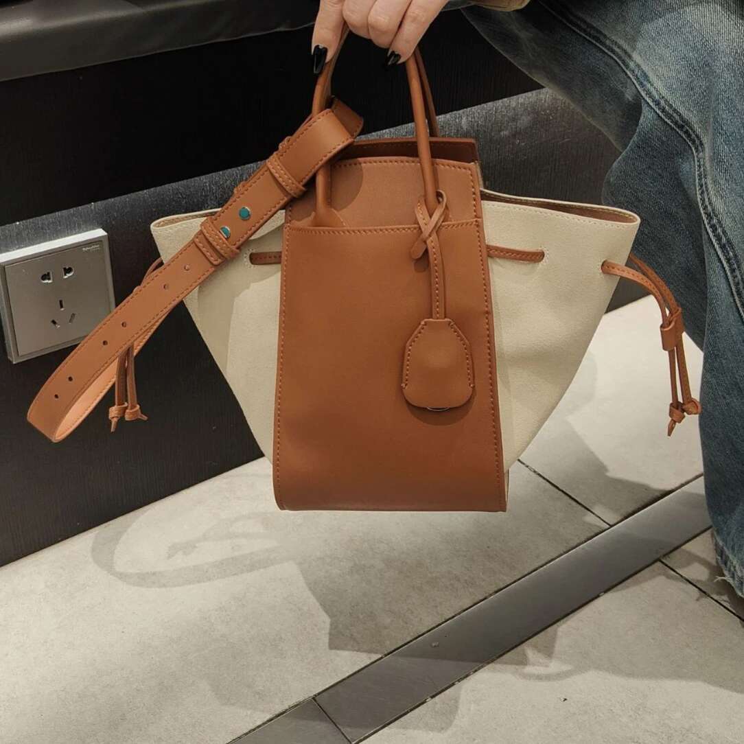 Top Layer Cowhide Wing 2025 New Niche Design Genuine Leather Drawstring Single Shoulder Crossbody Women Hand Bucket Bag