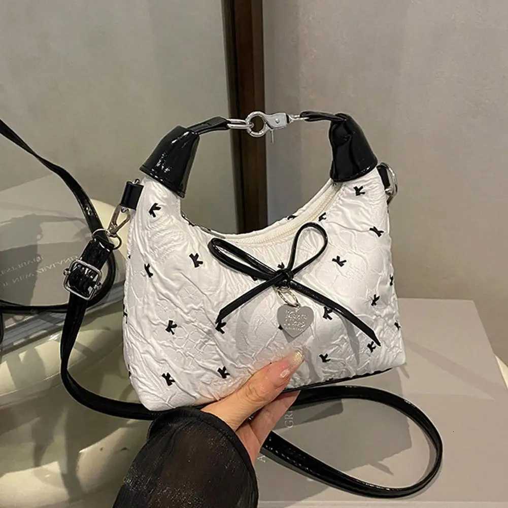 Bow Crossbody bag for women Sweet Fashion Print Metal heart Pendant Hand-held Single shoulder bag Commute Handbag Underarm pouchT2511112