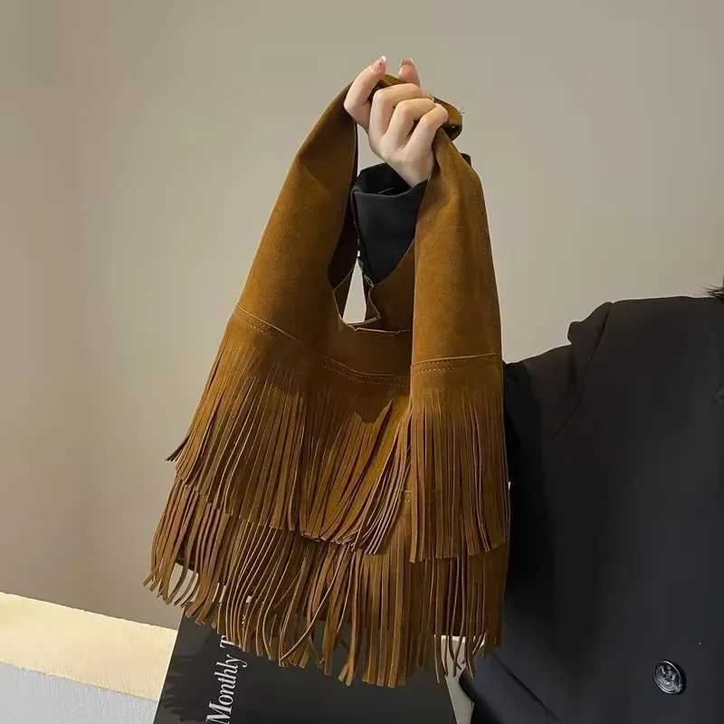 High end minimalist handbag 2025 autumn/winter foldable tassel single shoulder womens large capacity frosted bucket bagXJ250412
