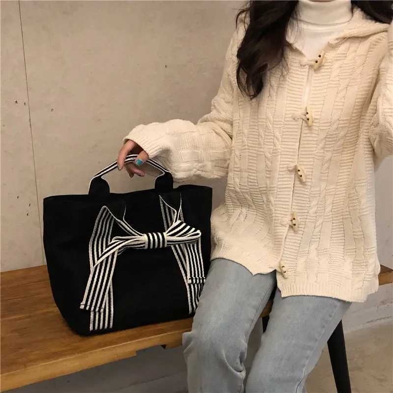 Fi Joker Korean style bag bow canvas bag lunch bag simple small fresh handbag womens bagXJ250412