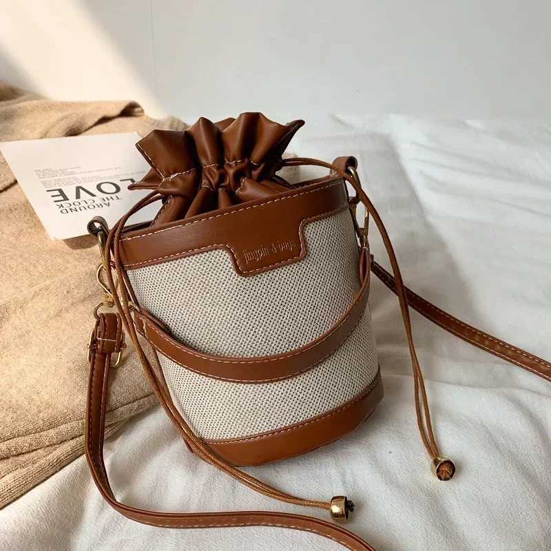Womens shoulder bag cylindrical PU leather bucket womens cross body bag casual Drstring handbag summer travel shoppingXJ250412