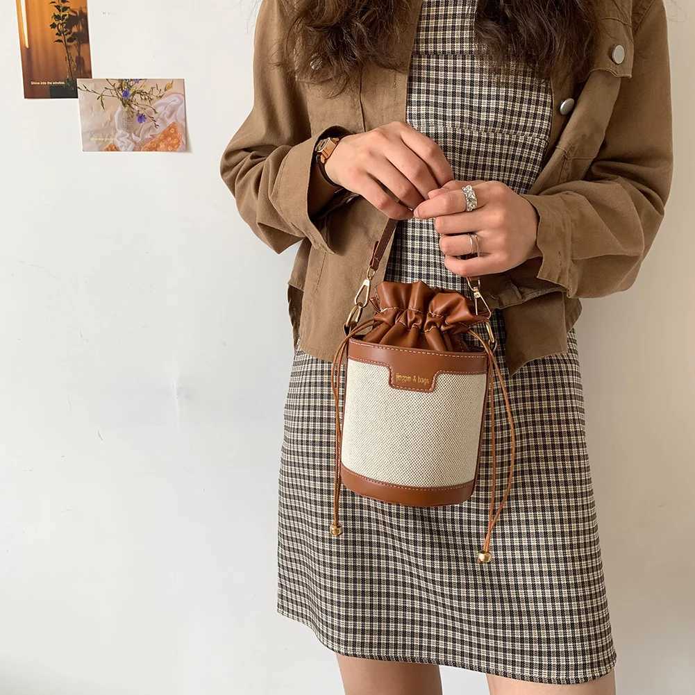 Womens retro cylindrical shoulder bag Drstring bucket leather cross body bagXJ250412