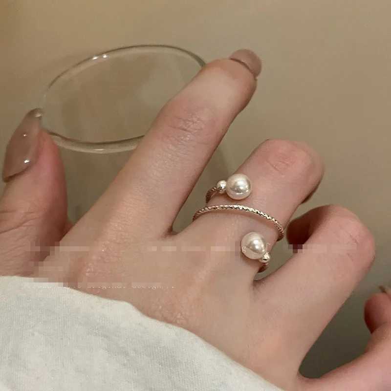 A simple double pearl ball adjustable ring with an opening suitable for womens personality circular pearl geometric index ring wedding jewelryXJ250412