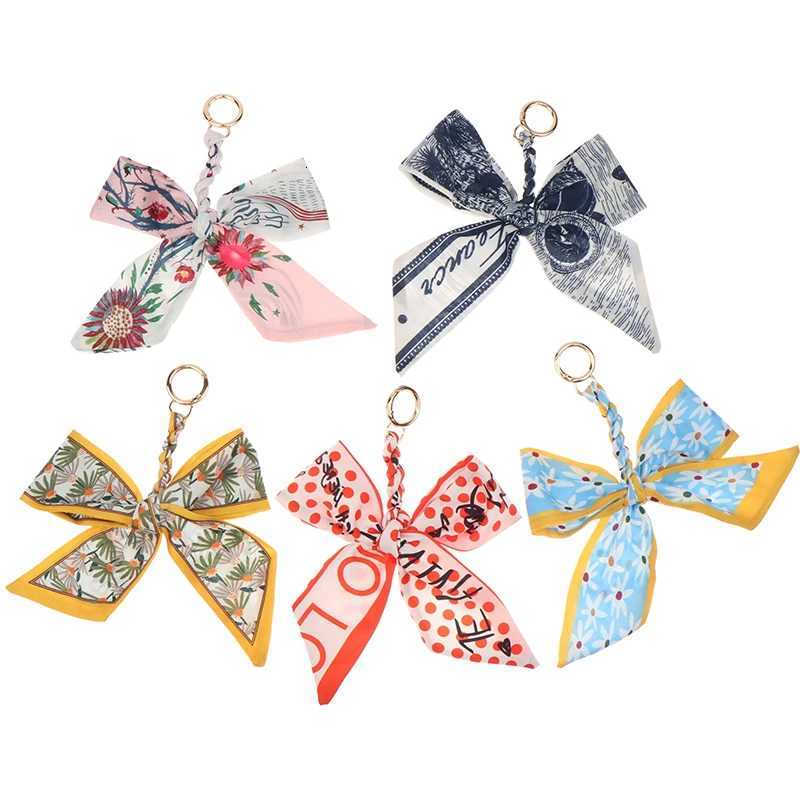 CC88Camellia Silk Scarf Bowknot Keychain Pendant Fresh Womens Bag Decor Ribbon Bow Romantic Bag Charm Fashion AccessoriesW251112