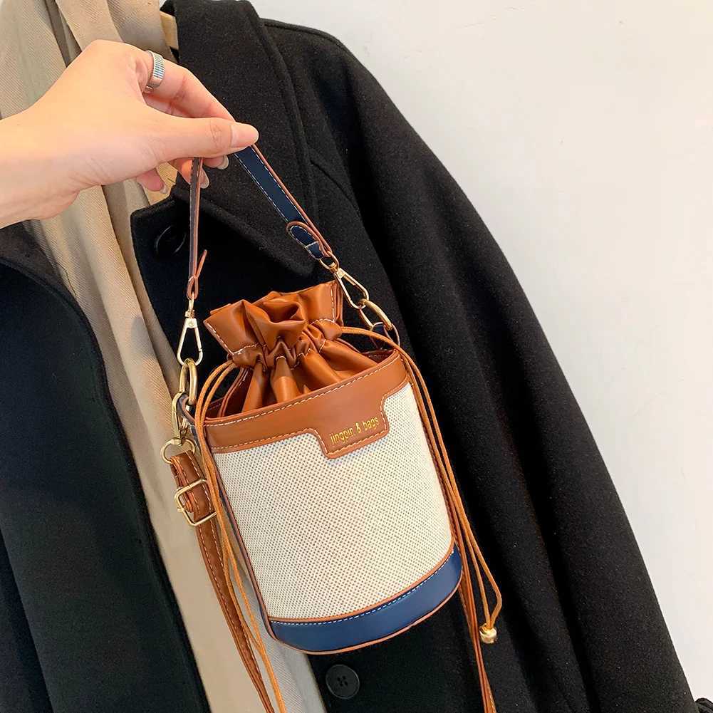 Womens retro cylindrical shoulder bag Drstring bucket leather cross body bagXJ250412