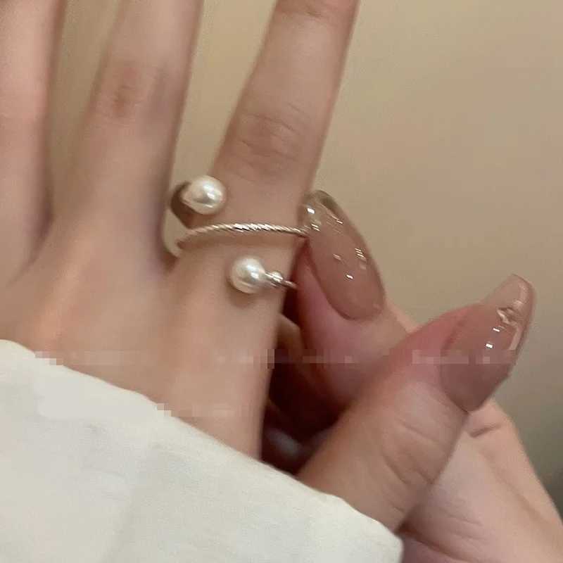 A simple double pearl ball adjustable ring with an opening suitable for womens personality circular pearl geometric index ring wedding jewelryXJ250412