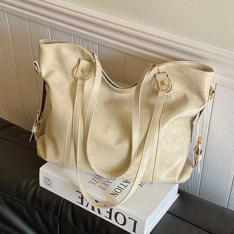 Large capacity womens shoulder bag Fi homeless shopping bag solid color soft leather cross body handbag womens travel handbagXJ250412