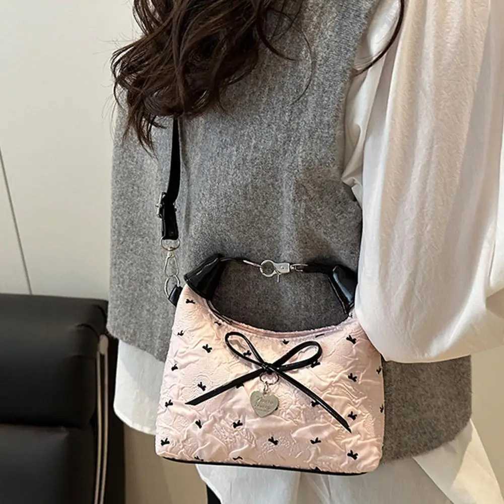 Bow Crossbody bag for women Sweet Fashion Print Metal heart Pendant Hand-held Single shoulder bag Commute Handbag Underarm pouchT2511112