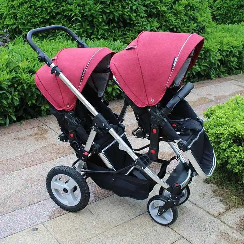 New dual baby stroller with adjustable seat height and orientation. High view dual baby stroller with adjustable stroller arms W250411
