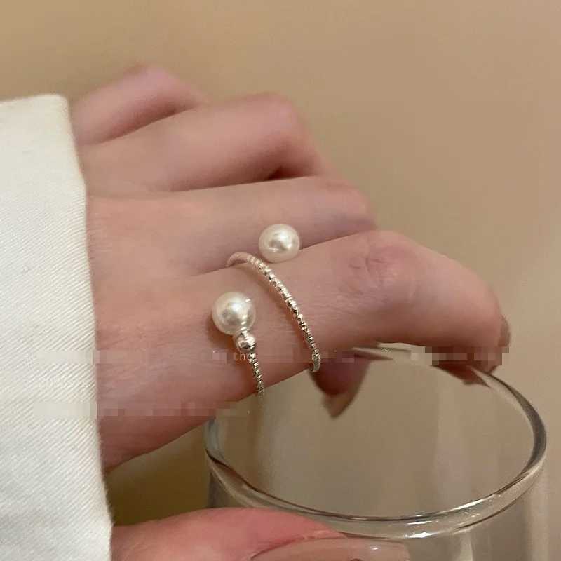 A simple double pearl ball adjustable ring with an opening suitable for womens personality circular pearl geometric index ring wedding jewelryXJ250412