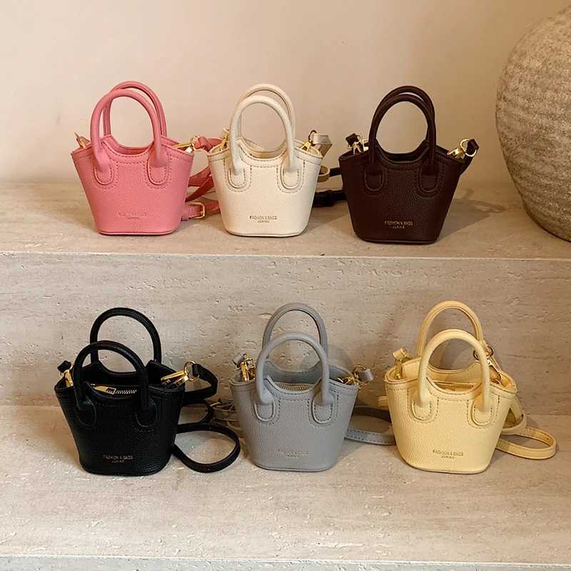FI Super Mini Cross shaped Bag Cute Womens Lipstick Bag Solid Color Pu Leather Bag Coin Wallet Earplug Bag Mini Bucket HandbagXJ250412