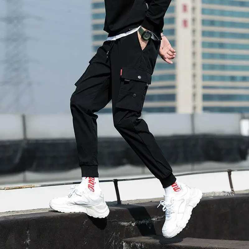 Classic running streetwear casual mens ribbon harem jogging pants mens slim fit spring cargo pants multi pocket womens Trousers W250411