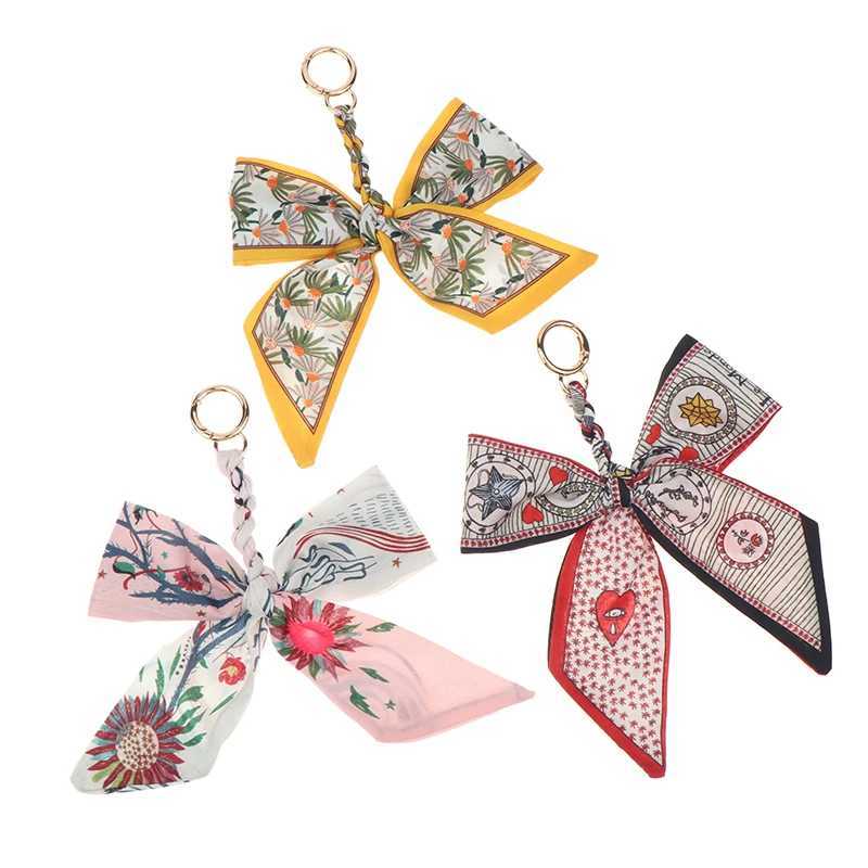 CC88Camellia Silk Scarf Bowknot Keychain Pendant Fresh Womens Bag Decor Ribbon Bow Romantic Bag Charm Fashion AccessoriesW251112