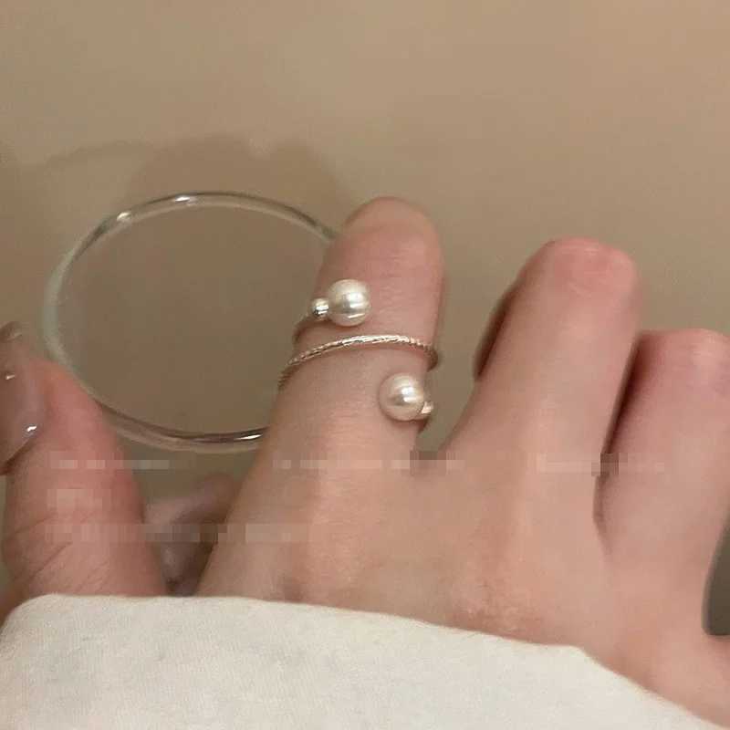 A simple double pearl ball adjustable ring with an opening suitable for womens personality circular pearl geometric index ring wedding jewelryXJ250412