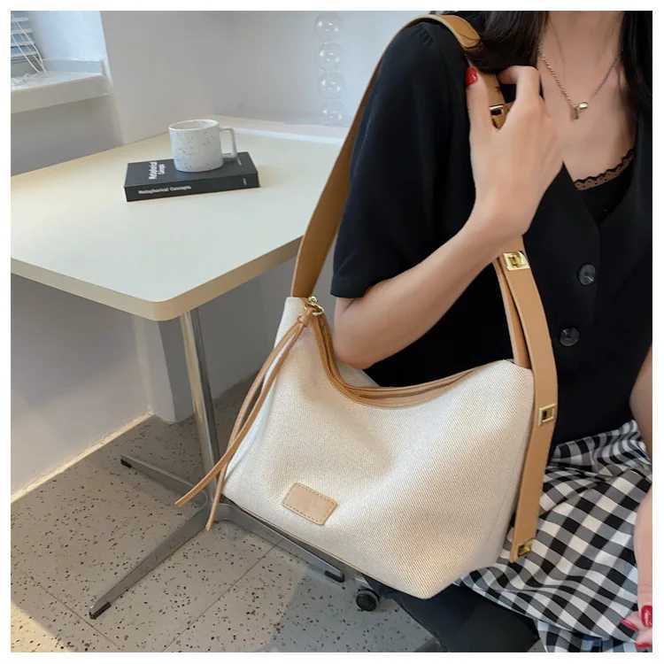 Fashionable and casual soft ordinary womens bag Oxford cloth shoulder foreskin leather shoulder strap handbag womens luxury bagXJ250412