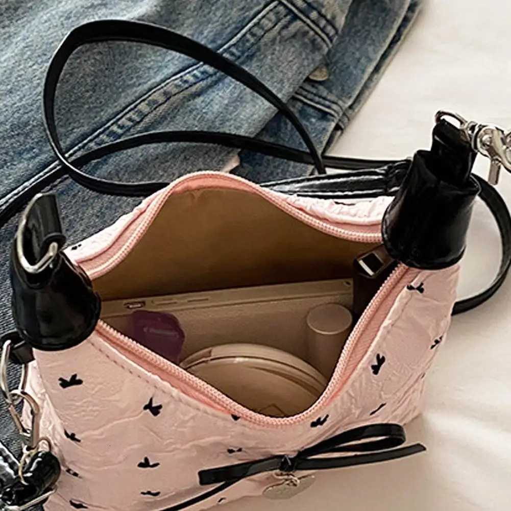 Bow Crossbody bag for women Sweet Fashion Print Metal heart Pendant Hand-held Single shoulder bag Commute Handbag Underarm pouchT2511112