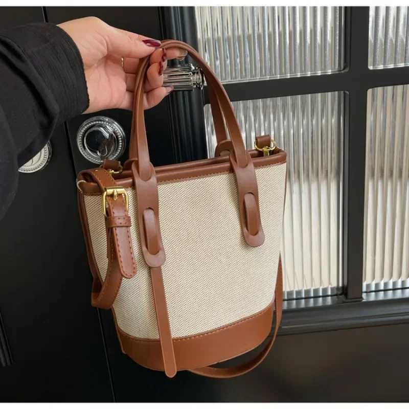 2025 Fi Versatile PU canvas bucket shoulder and cross body bag simple casual womens luxury handbagXJ250412