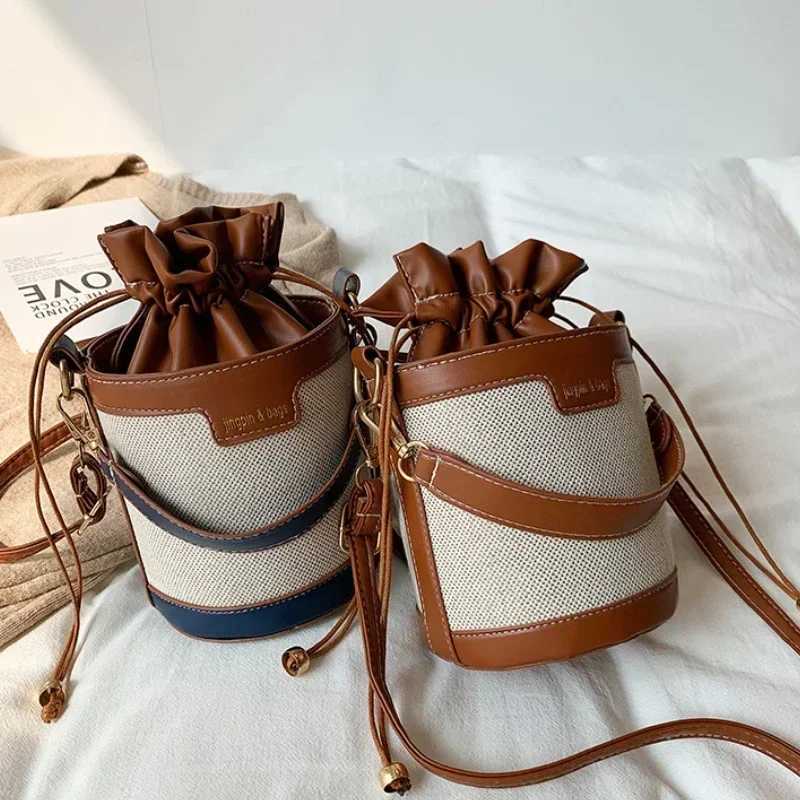 Womens shoulder bag cylindrical PU leather bucket womens cross body bag casual Drstring handbag summer travel shoppingXJ250412