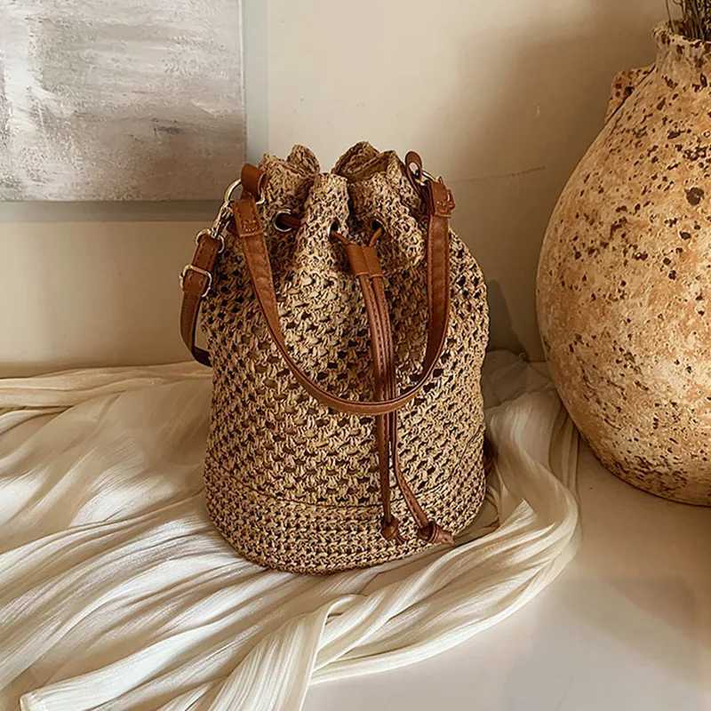 Knitted Bag Womens 2024 New Fi Bucket Bag Summer Niche 100 Str Beach Single Shoulder Cross BagXJ250412