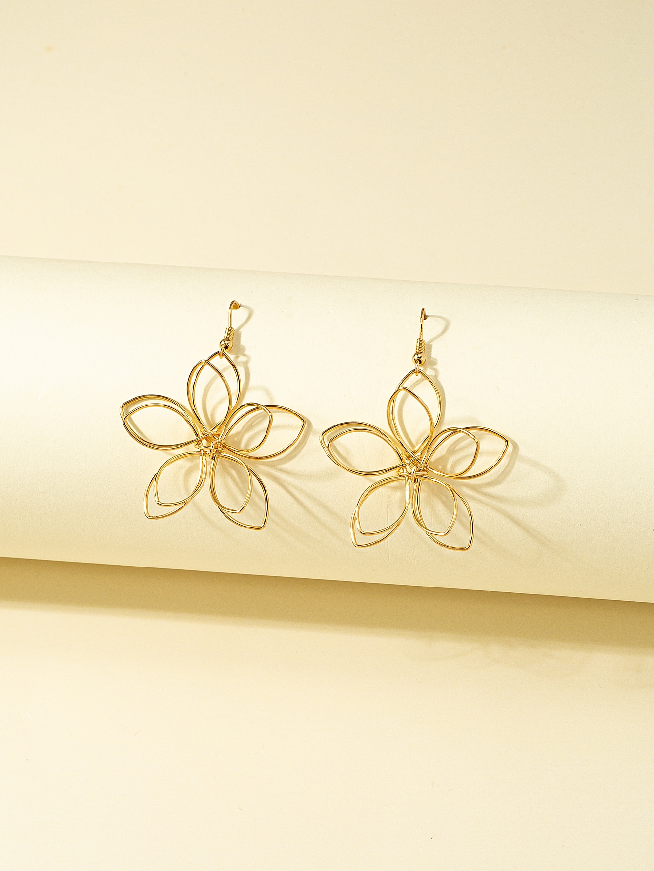 Ladies' earrings with golden flower shaped earrings