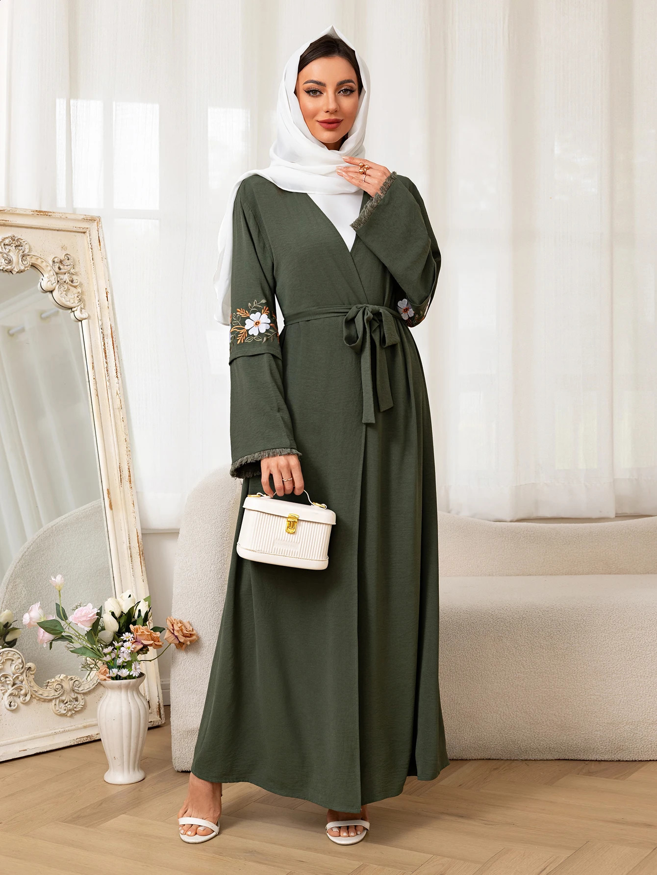 Fashionable green Muslim Abaya floral sleeve ed belt worn daily during Ramadan and Saudi Arabias festivals in the Middle East 250411