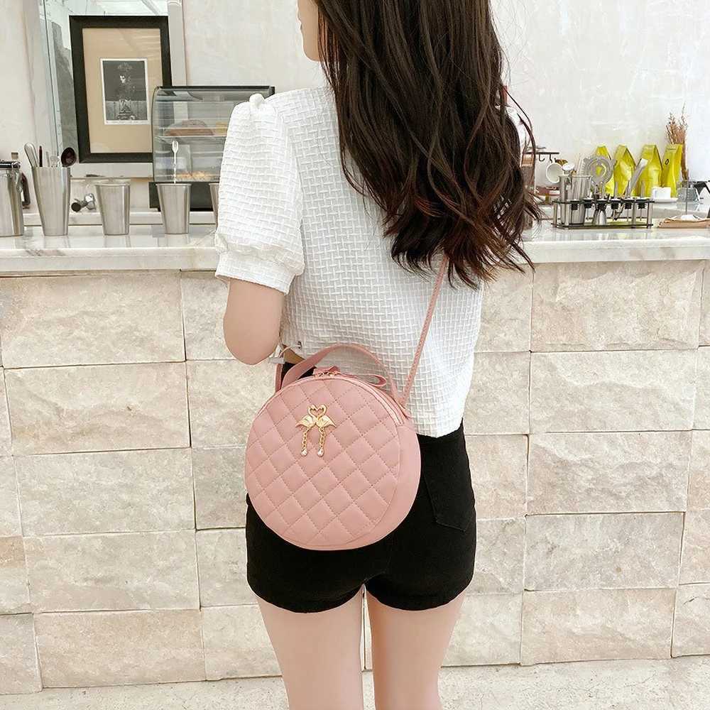 Leisure diamond patterned embroidered hand-held small round bag new fashionable and simple double heron decoration womens crosT2511112