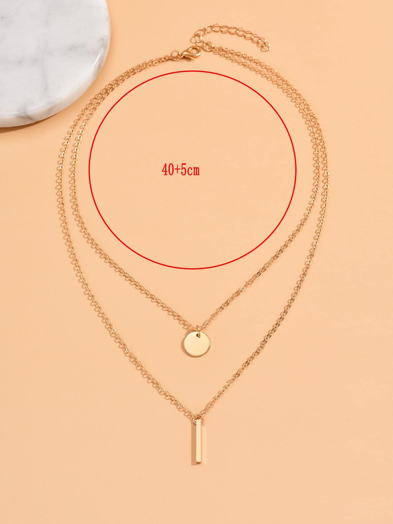 Double layered geometric element necklace
