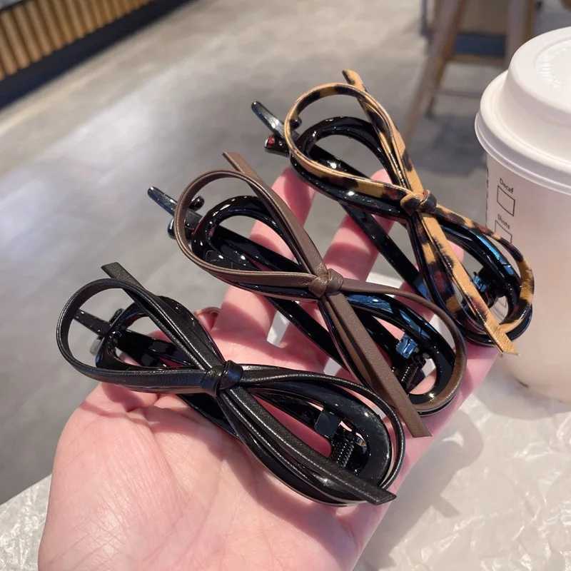 New twisted hair clip PU bow bucket large-sized hair clip plastic hair clip sweet daily headband female hair accessories Y2504012