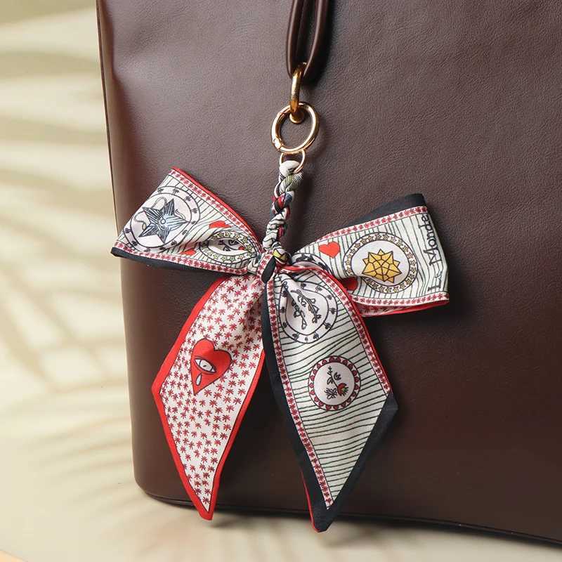 CC88Camellia Silk Scarf Bowknot Keychain Pendant Fresh Womens Bag Decor Ribbon Bow Romantic Bag Charm Fashion AccessoriesW251112
