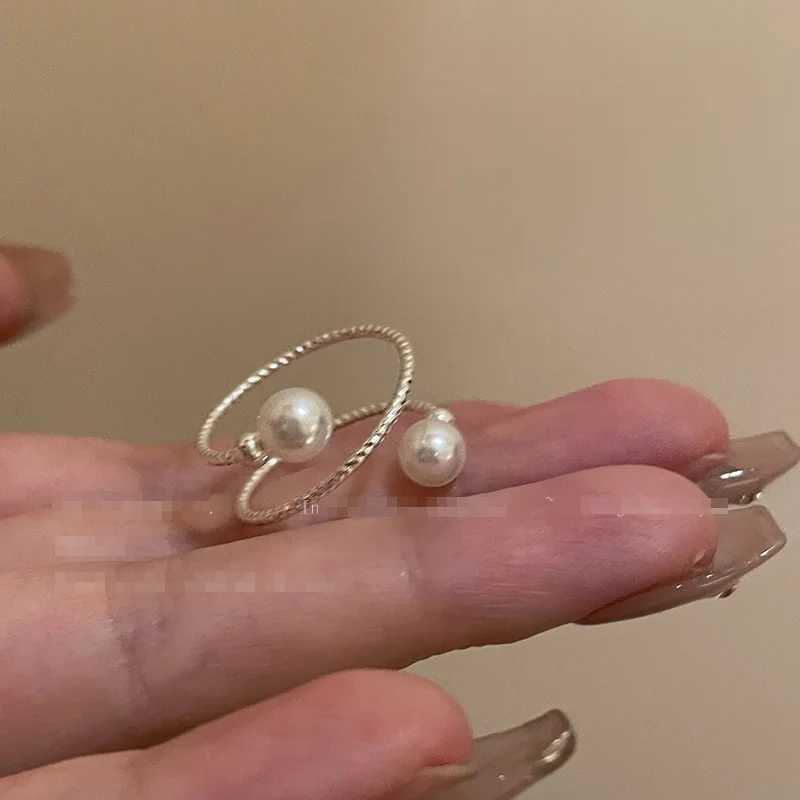 A simple double pearl ball adjustable ring with an opening suitable for womens personality circular pearl geometric index ring wedding jewelryXJ250412