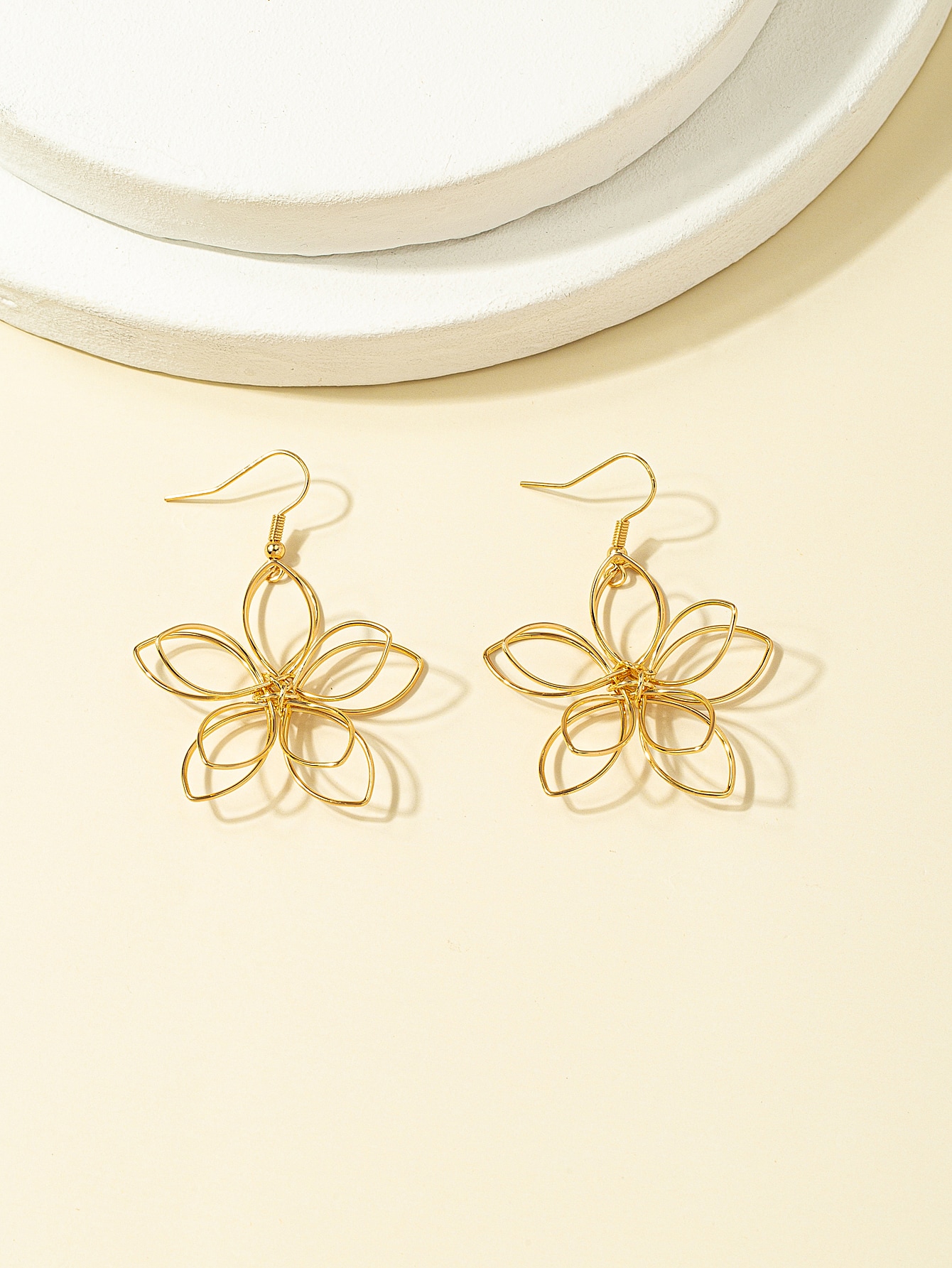 Ladies' earrings with golden flower shaped earrings