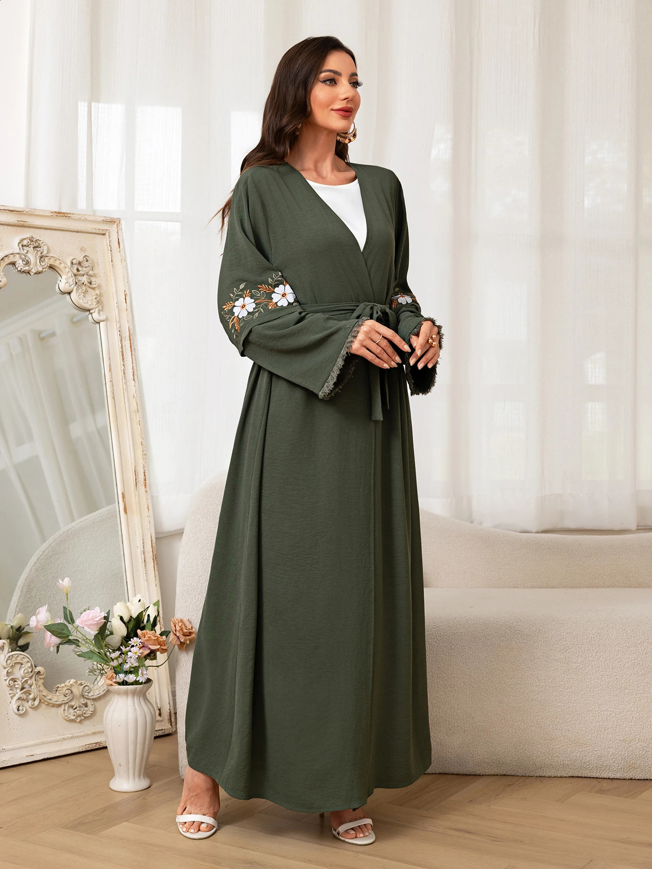 Fashionable green Muslim Abaya floral sleeve ed belt worn daily during Ramadan and Saudi Arabias festivals in the Middle East 250411